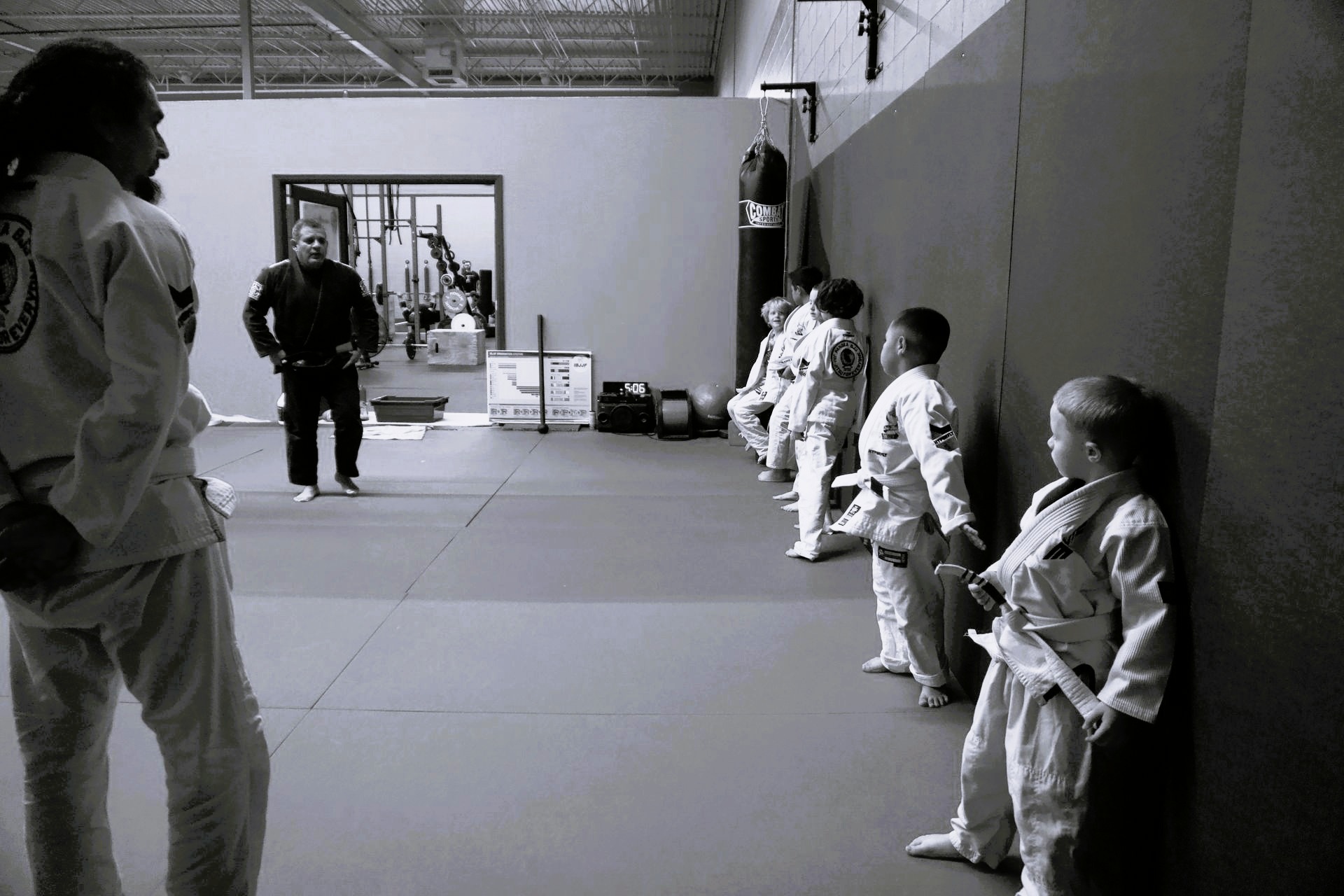 Kids BJJ class at Pangea Jiu Jitsu - children lined up in gis